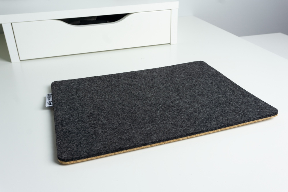 Blackmerino wool felt mouse pad on white desk