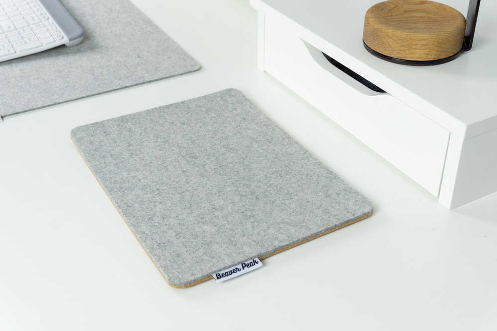 Grey merino wool felt mouse pad on white desk with matching grey wool felt desk mat in background