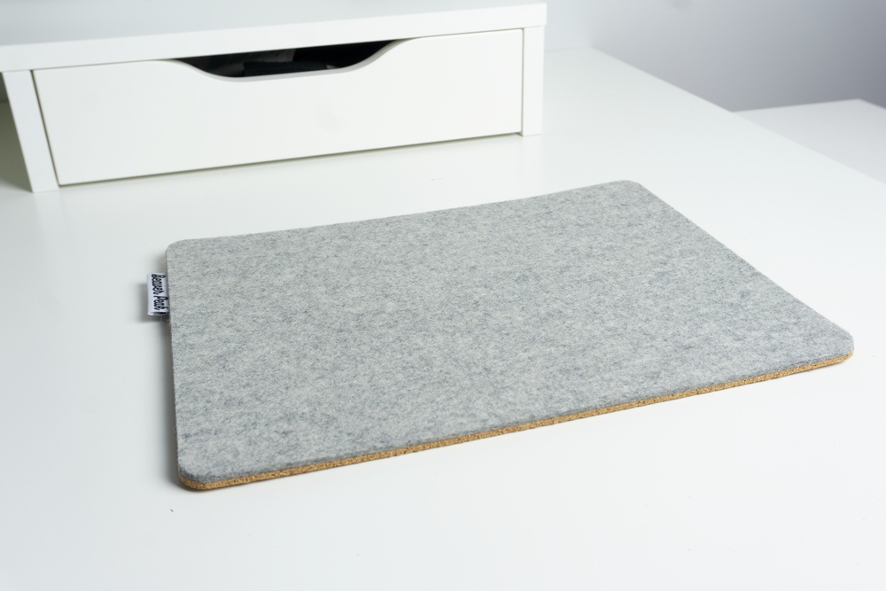Grey merino wool felt mouse pad on white desk