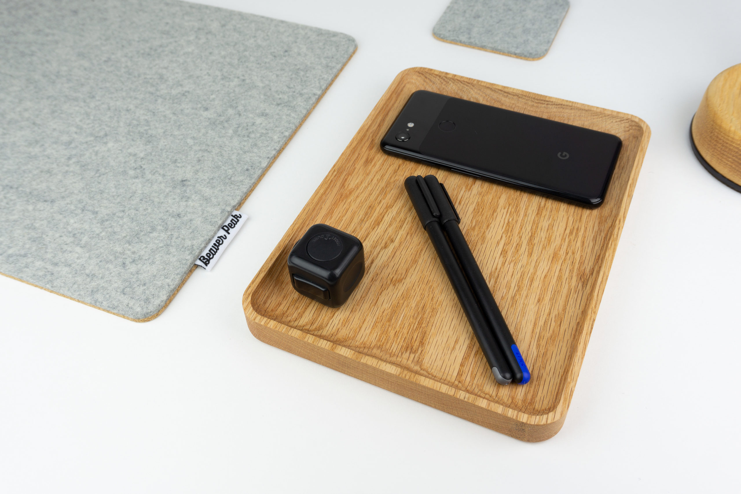 Wood desk tray with phone and pens