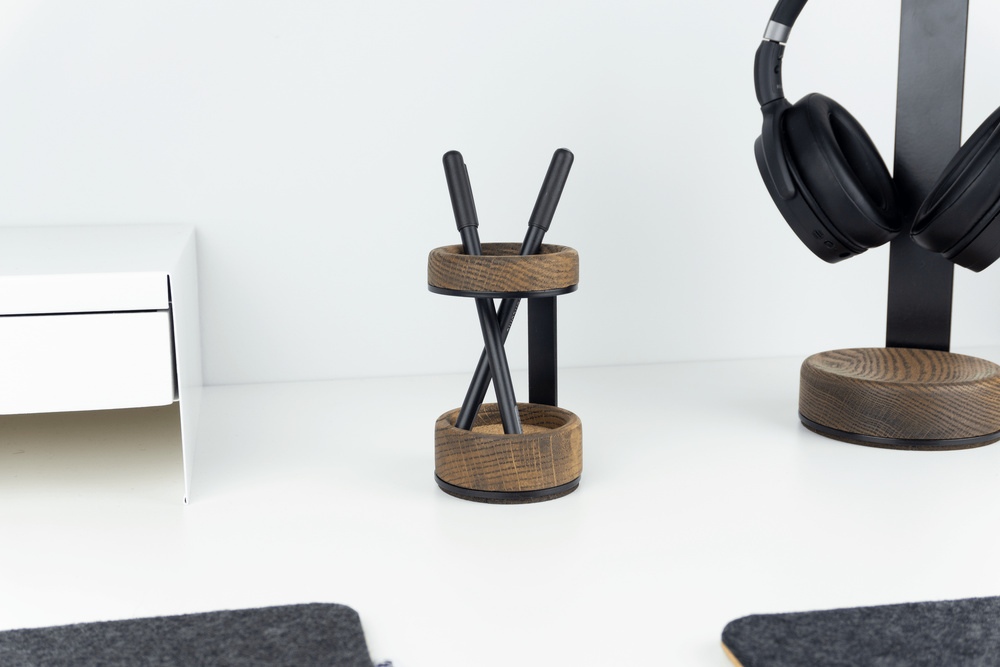 Wooden Pen Stand - Walnut with two pens next to matching wooden headphone stand