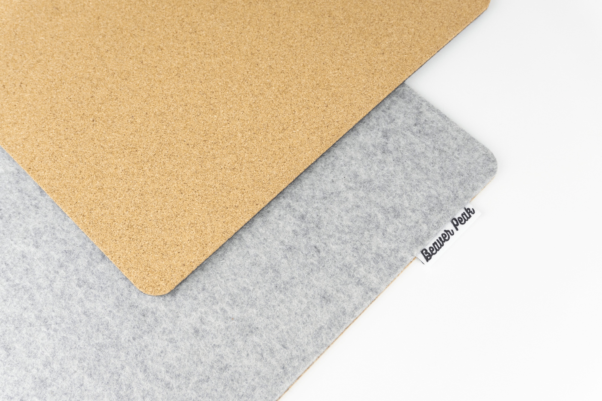 Merino wool desk mat with cork anti-slip bottom layer being shown.