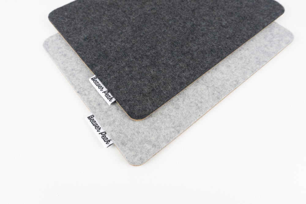 Merino wool felt mouse pad colour comparison, showing grey mouse pad against black mouse pad