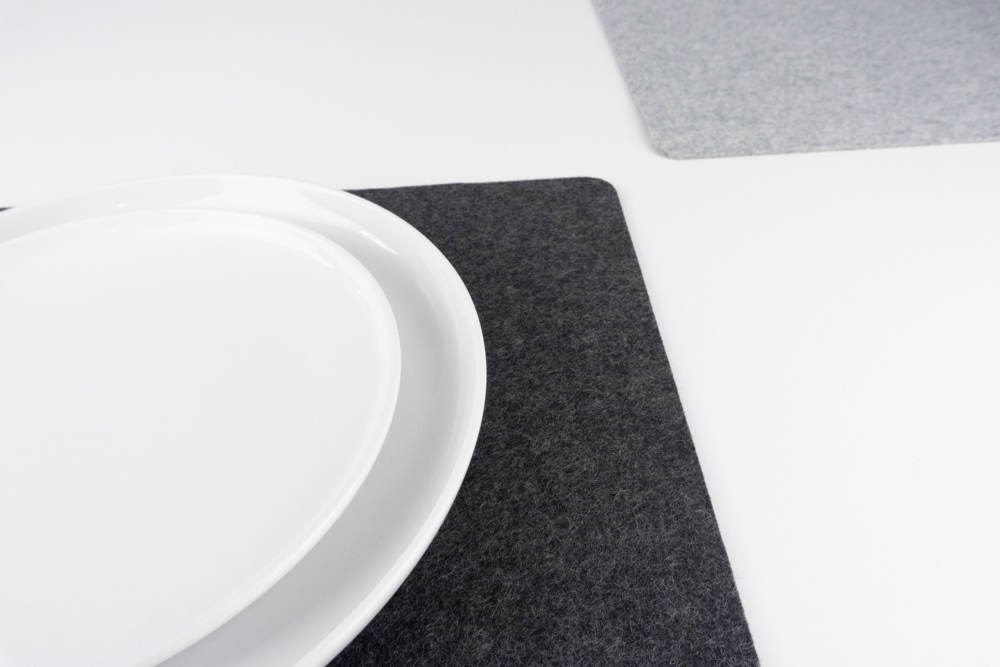 Set of black and grey merino wool felt placemats shown with mixed colours