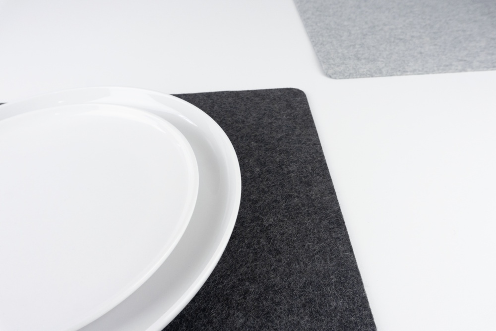 Set of black and grey merino wool felt placemats shown with mixed colours.