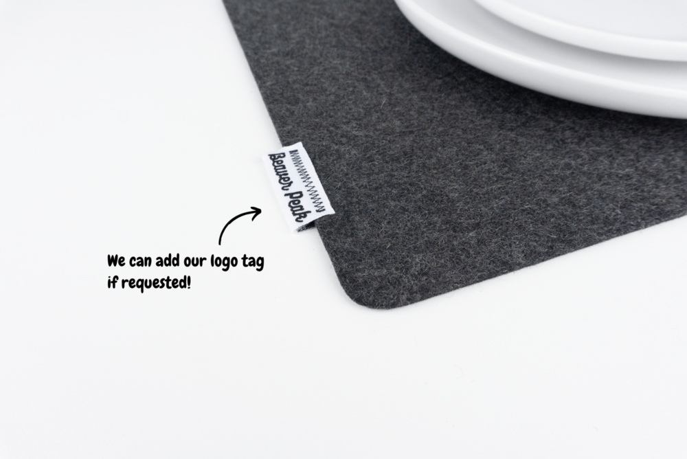 Closeup of merino wool felt placemat - black with optional logo.