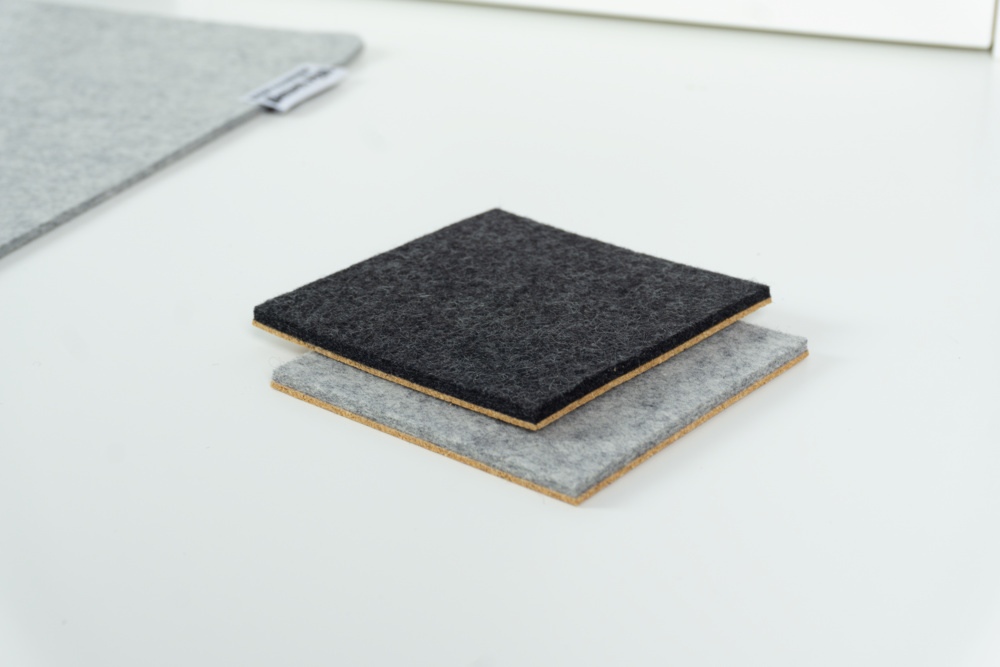 Comparison of black and grey merino wool felt coasters with square corners